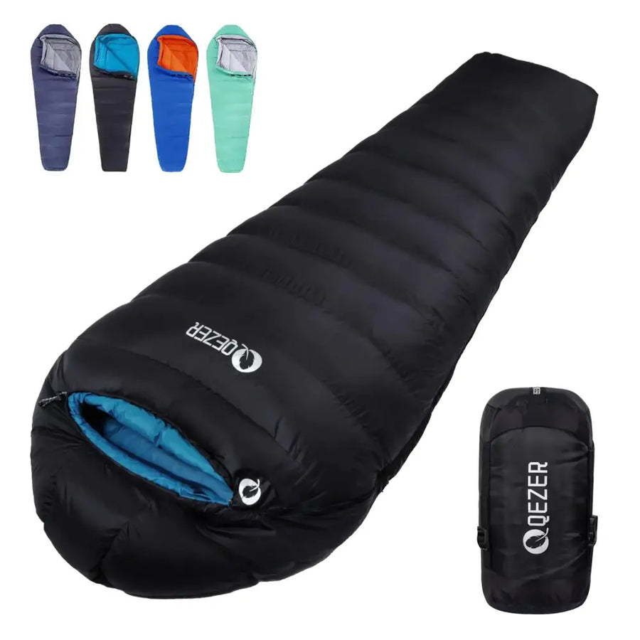 Black qezer sleeping bag with blue interior and a matching compression sack.