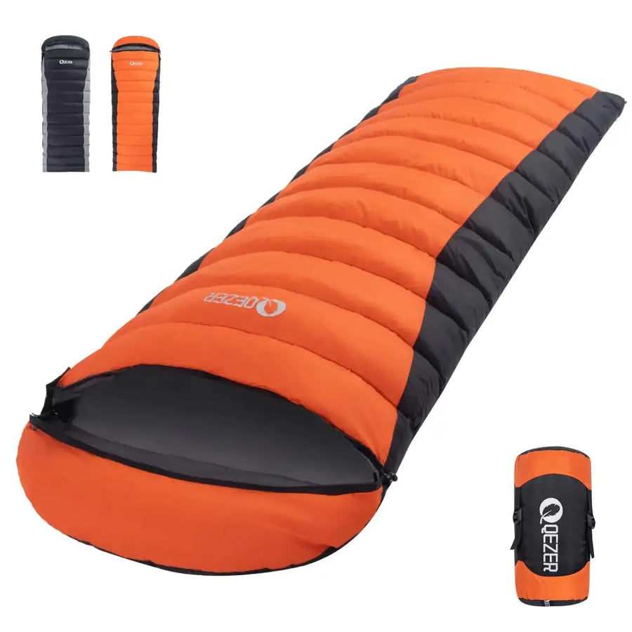 Orange and black quilted sleeping bag with a gray logo on the side, shown in its rolled-up carrying case.