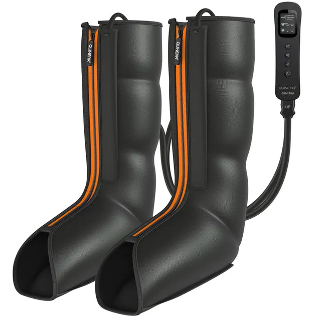 Black textured fabric compression boots with orange zipper accents and a matching control unit.