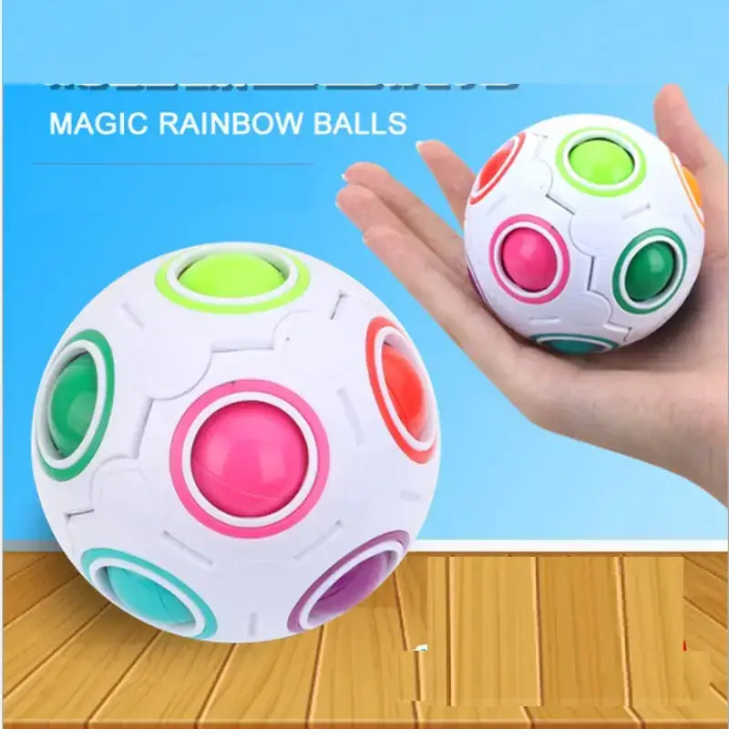 White plastic magic rainbow balls with colorful, segmented circular buttons in pink, green, red, and teal.