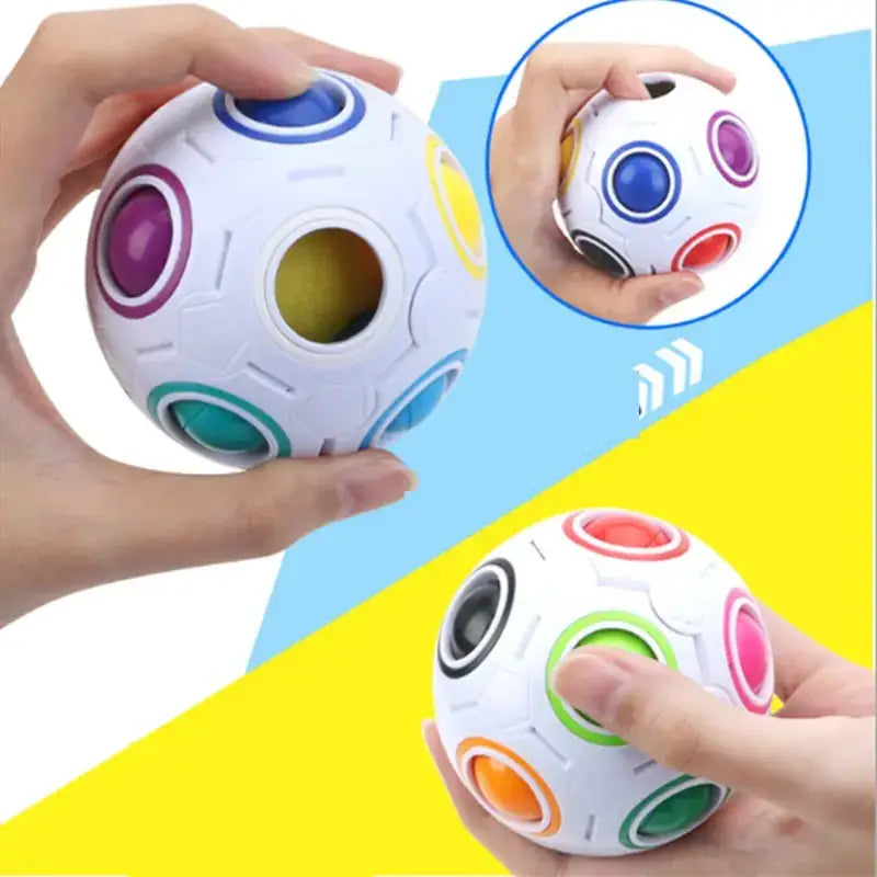White spherical puzzle ball with colorful circular buttons in blue, purple, yellow, green, red, and orange.