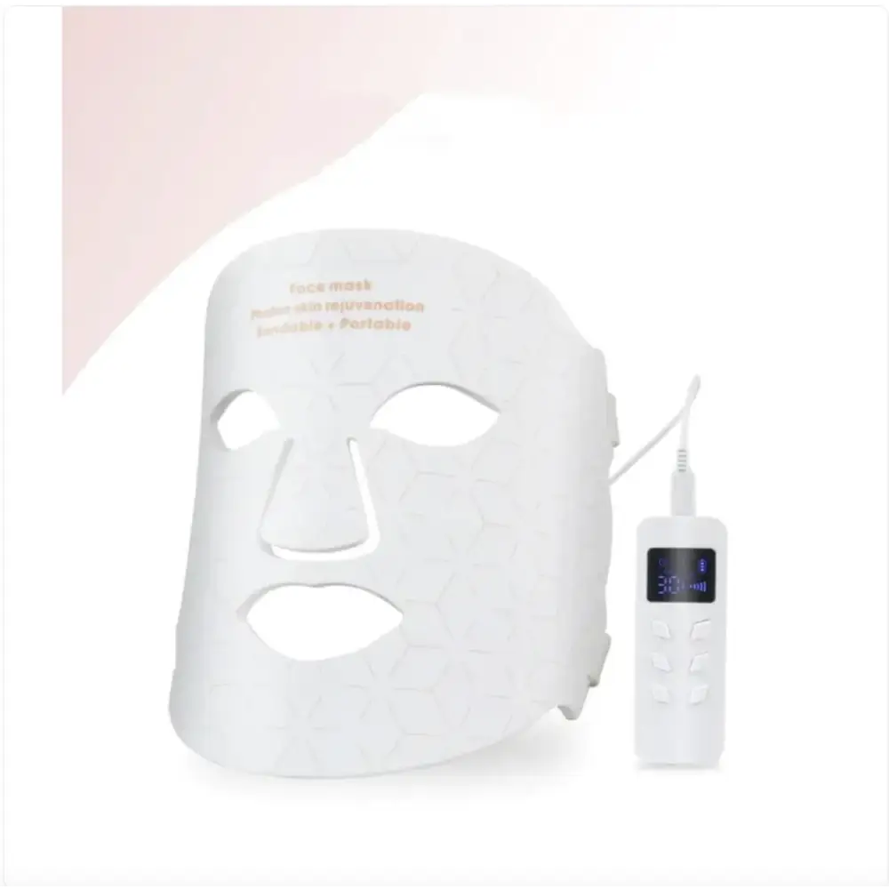 White honeycomb-patterned face mask with matching portable control unit.