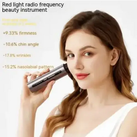 A sleek, silver and black handheld red light radio frequency beauty device with a cylindrical design.