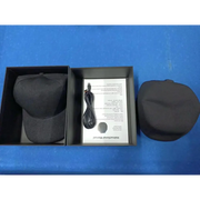 Black baseball cap with textured fabric and adjustable strap