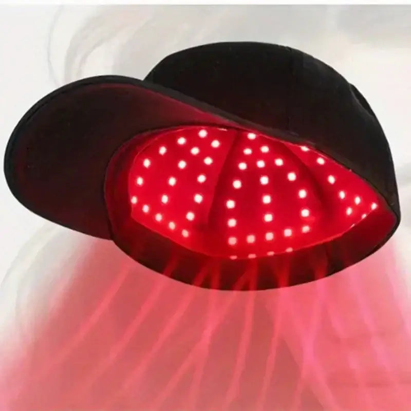 Black velvet cap with a glowing red led panel featuring evenly spaced white dots.