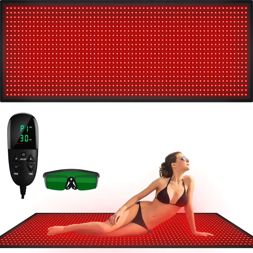 Red led light therapy mat with black border and control unit, green protective eyewear