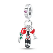 Silver charm with dangling red rose, wine bottle engraved ’love,’ and two red wine glasses.
