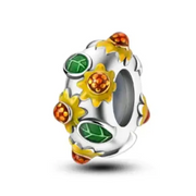 Silver charm with colorful enamel flowers and leaves in yellow, green, and orange.