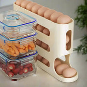 Cream-colored plastic egg rack holding brown eggs in its tiered compartments.