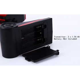 Black plastic transmitter with red accent strip, designed for battery replacement.