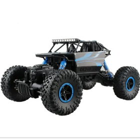 Black and blue remote-controlled off-road rock crawler with rugged tires, a reinforced chassis, and led light bar on top.