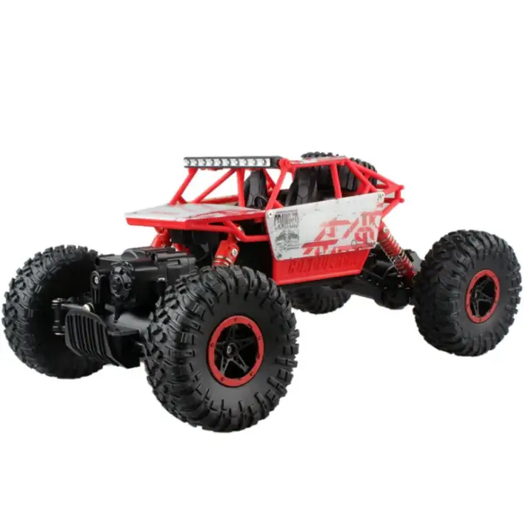 Red and black remote-controlled off-road truck with rugged tires, a reinforced frame, and detailed suspension components.