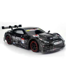 Black diecast race car model with red-accented wheels and detailed sponsor decals.