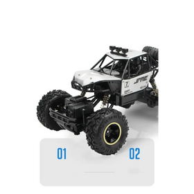 Black and white jpre remote-controlled off-road truck with rugged tires and detailed suspension.
