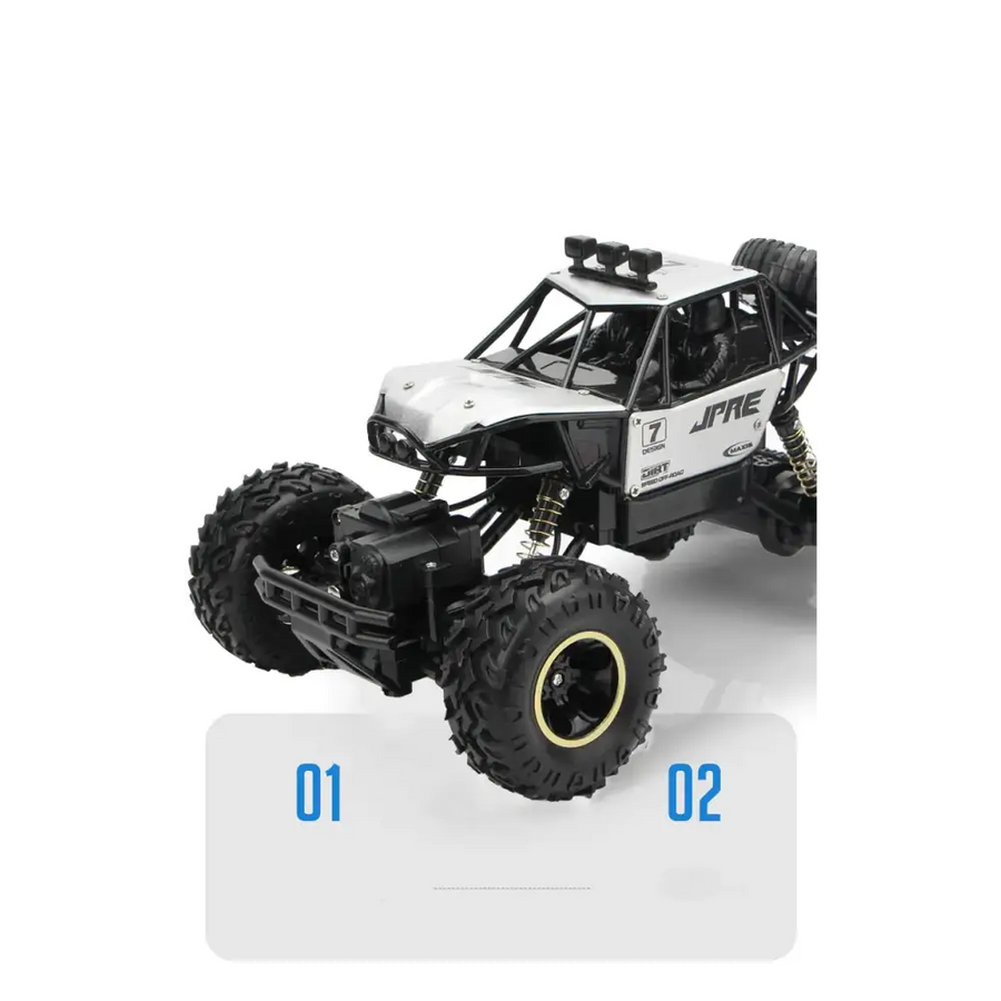 Black and white jpre remote-controlled off-road truck with rugged tires and detailed suspension.