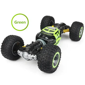 Vibrant lime green and black remote-controlled off-road monster truck with rugged tires and yellow suspension components.