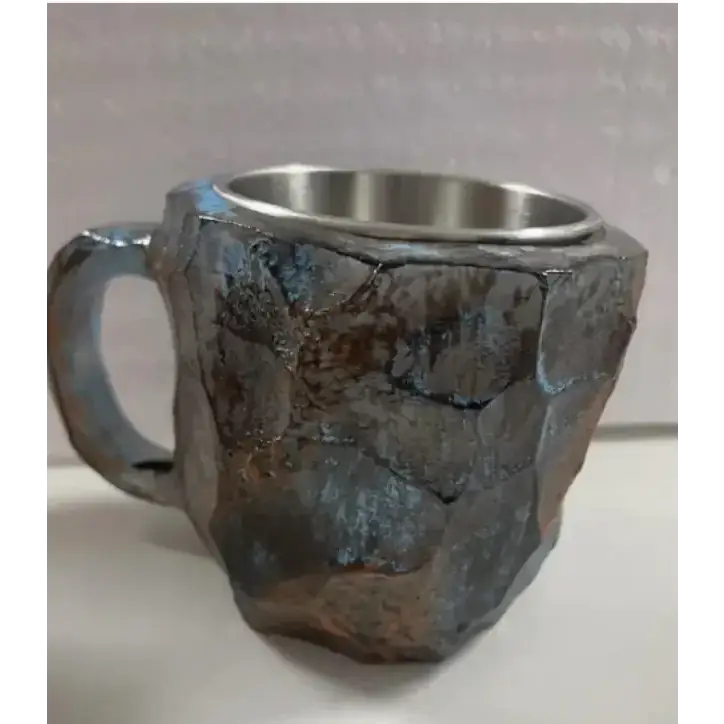 Rustic stone-textured mug with a brushed stainless steel interior and handle.