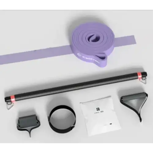 Purple resistance band with black metal attachments and a white packet of instructions.