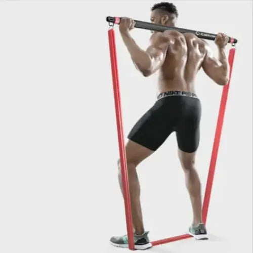 Red resistance band with black handles, designed for strength training.