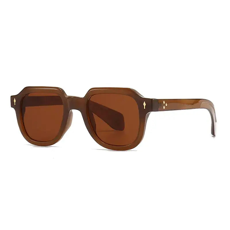 Brown tortoiseshell acetate sunglasses with amber-tinted lenses and gold-tone decorative accents on the temples.