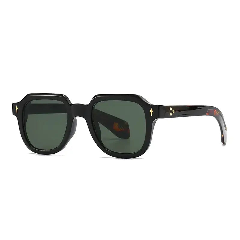 Black acetate sunglasses with tortoiseshell-patterned temples and gold-tone diamond-shaped accents on the frame.