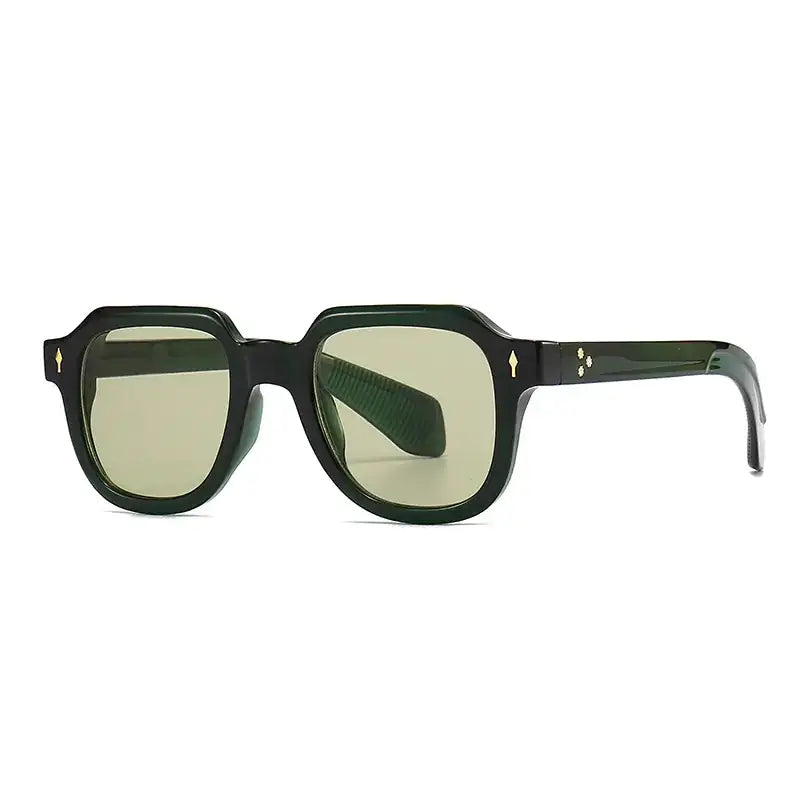 Black-framed sunglasses with olive-green lenses and gold-tone diamond-shaped accents on the temples.