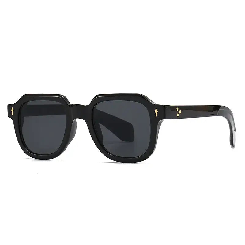 Black square-framed sunglasses with dark gray lenses and gold-tone diamond-shaped accents on the temples.