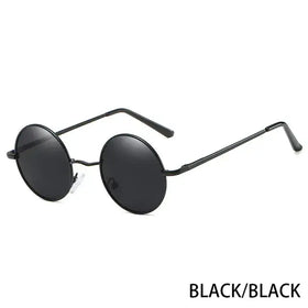 Black round-frame sunglasses with dark lenses and a sleek metal design.