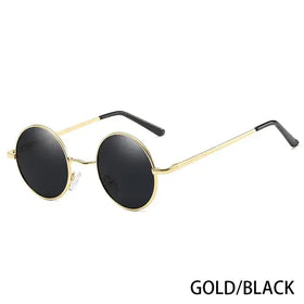 Gold-rimmed round sunglasses with black lenses and black temple tips.