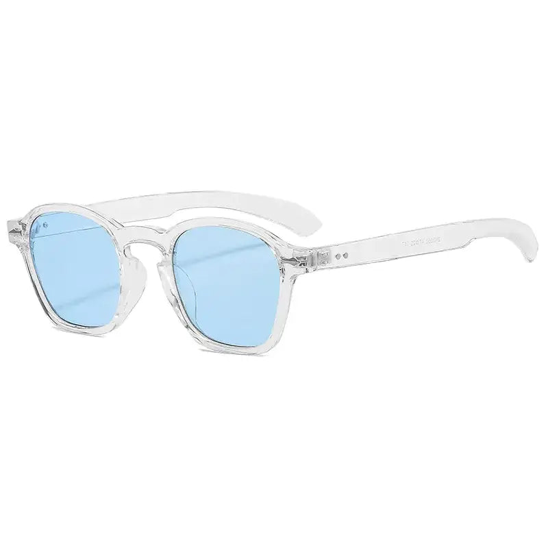 Clear acetate-framed sunglasses with light blue gradient lenses.