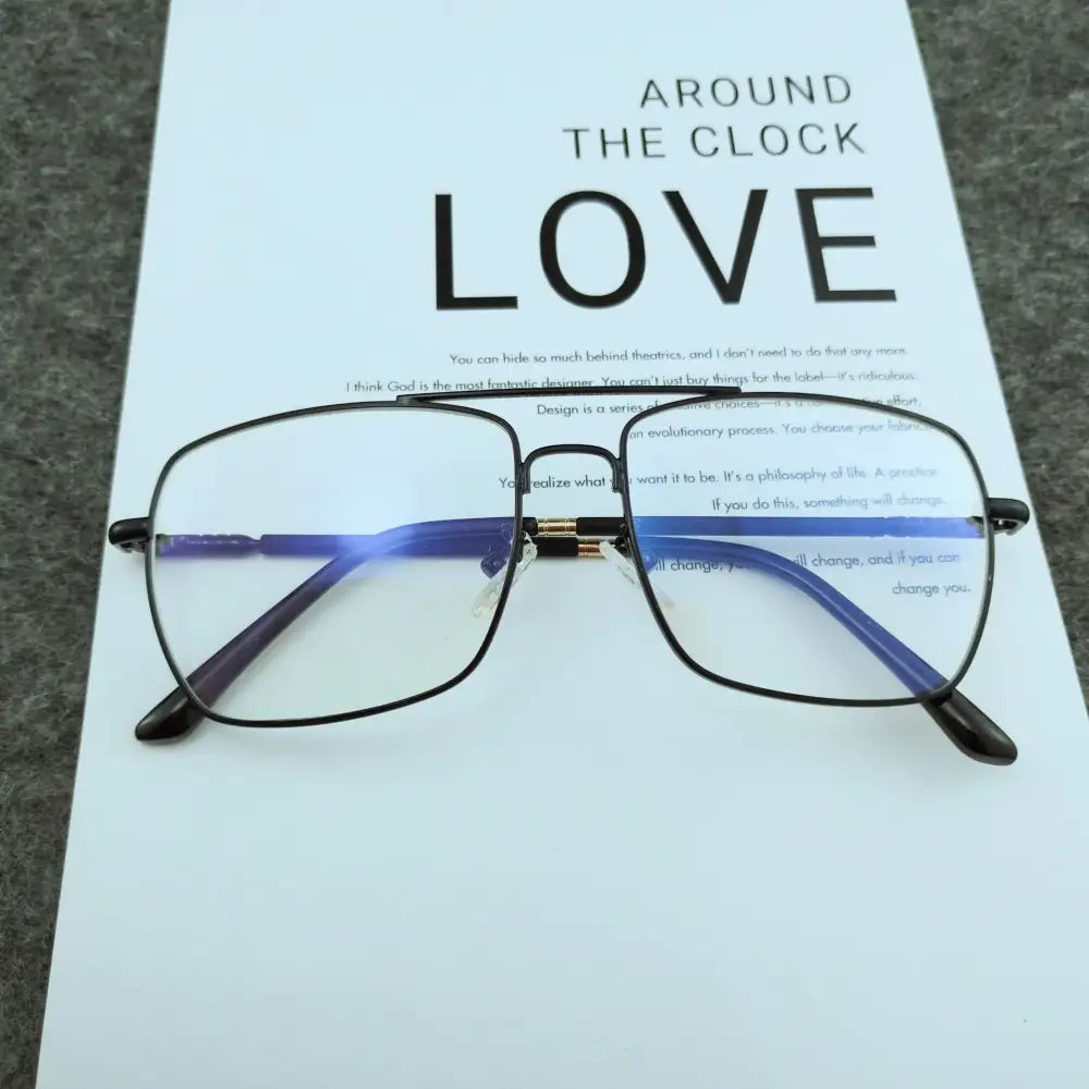 Black-framed rectangular glasses with blue-tinted temples and gold-colored bridge details.