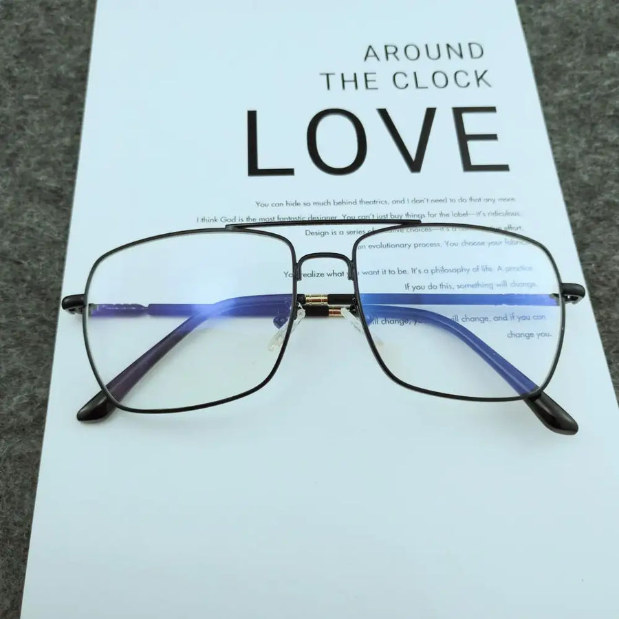 Black-framed rectangular glasses with blue-tinted temples and gold-colored bridge details.