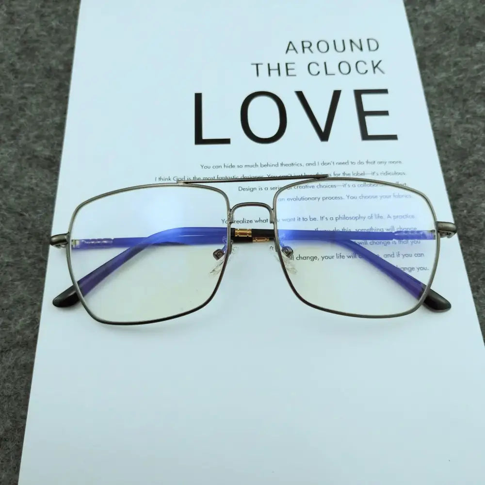 Rectangular-framed eyeglasses with a metallic silver frame and vibrant blue temple arms.