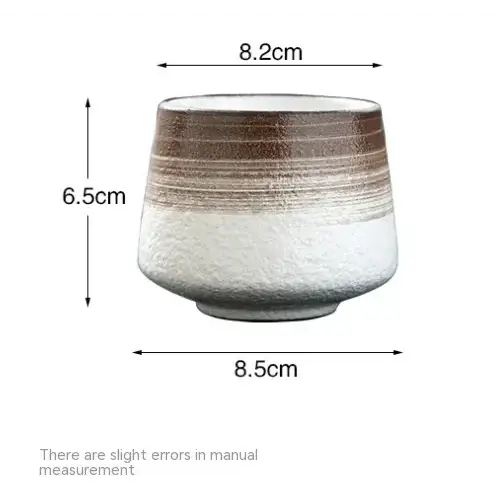 A ceramic planter with a textured, gradient finish transitioning from white to brown stripes and a slightly flared rim.