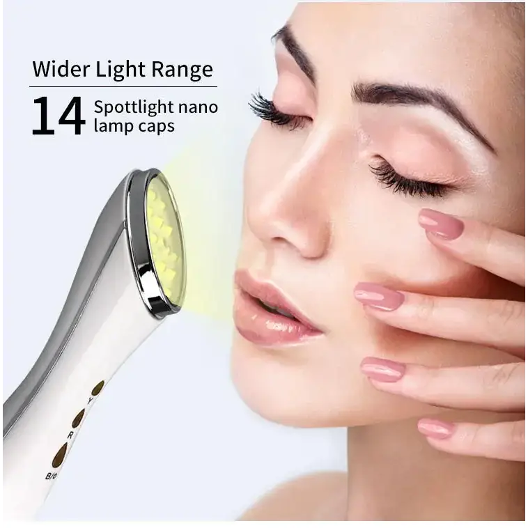 Silver and white handheld facial device with 14 spotlight nano lamp caps emitting a soft yellow glow.