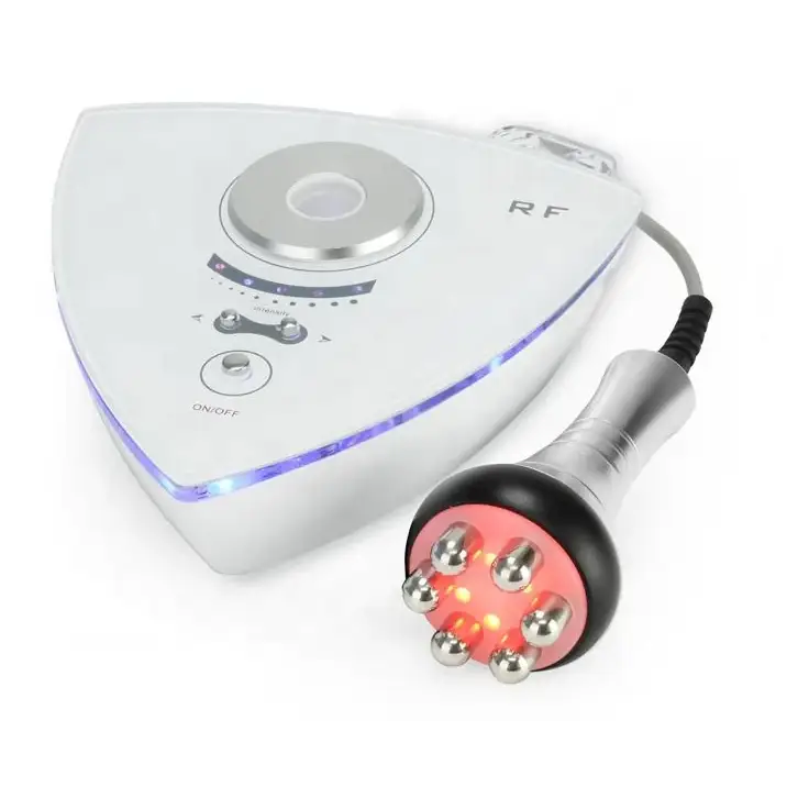 White triangular rf beauty device with silver accents and a glowing blue led strip, paired with a handheld applicator featuring six metallic spheres on a red-orange base.