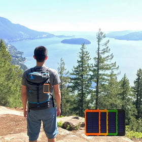 A rugged, rectangular solar-powered portable charger with a bright orange frame and dark blue solar panels.