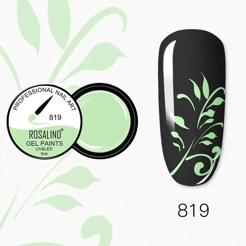 A sleek, glossy black nail with delicate light green leafy decals applied in a swirling pattern.