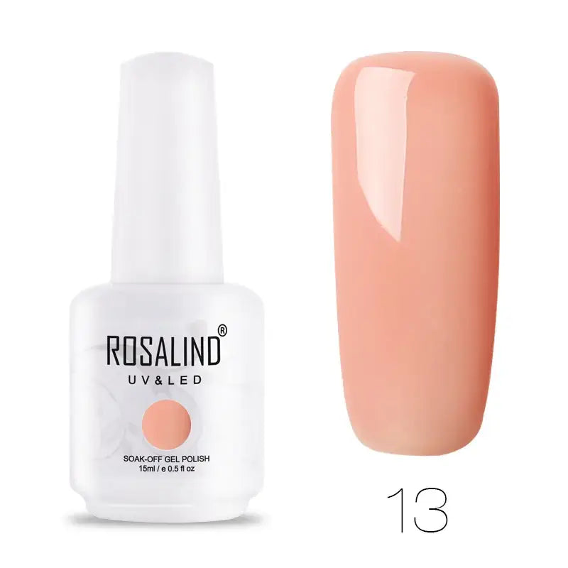 A sleek white bottle of rosalind uv & led soak-off gel polish, featuring a soft peach-colored nail swatch beside it.