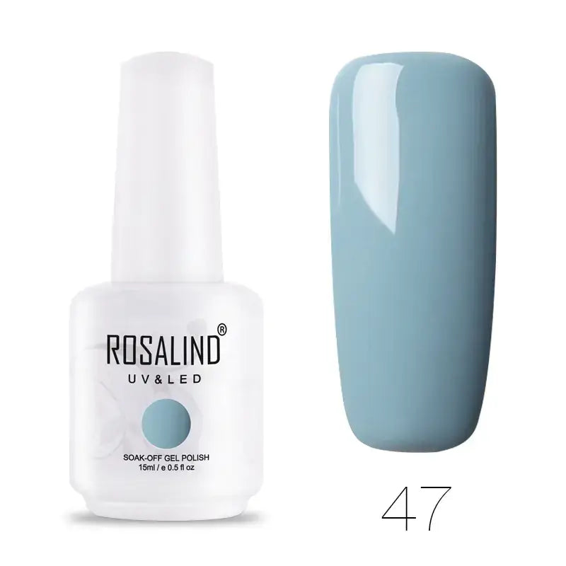 A sleek white bottle of rosalind uv&led soak-off gel polish, featuring a minimalist design with black lettering and a light blue circular accent on the label.