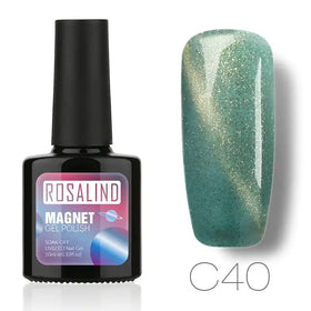 Rosalind magnet gel polish in shade c40, a shimmering teal with gold glitter that shifts under light.
