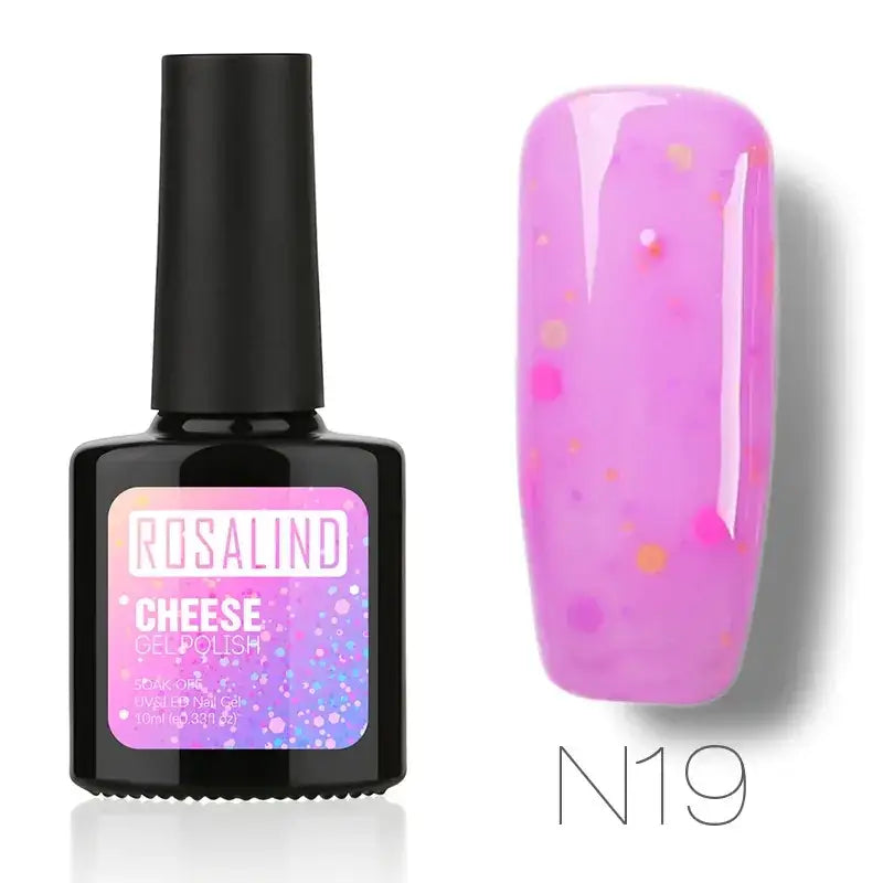 A vibrant pink glittery gel nail polish in a sleek black bottle with a gradient label, featuring the brand name ’rosalind’ and product line ’cheese gel polish,’ shown alongside its application on a fingernail.