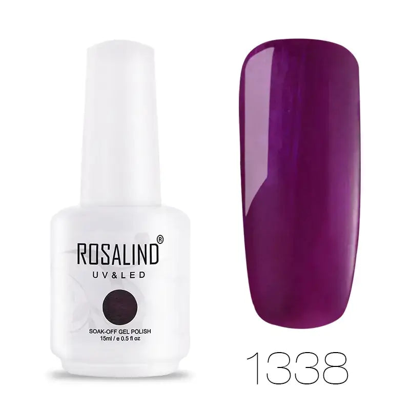 A sleek white bottle of rosalind uv & led soak-off gel polish, featuring a glossy purple nail finish in shade 1338.