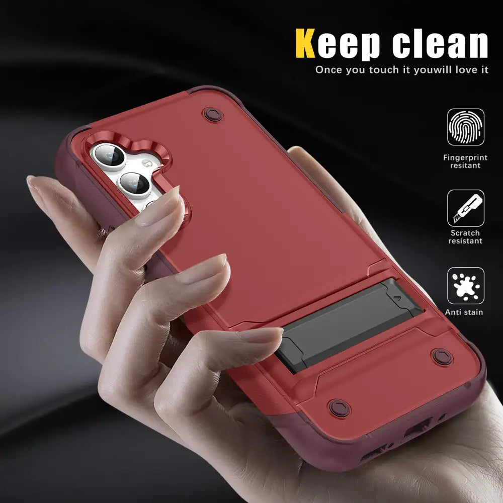 Red dual-layer phone case with a built-in stand and camera cutout.