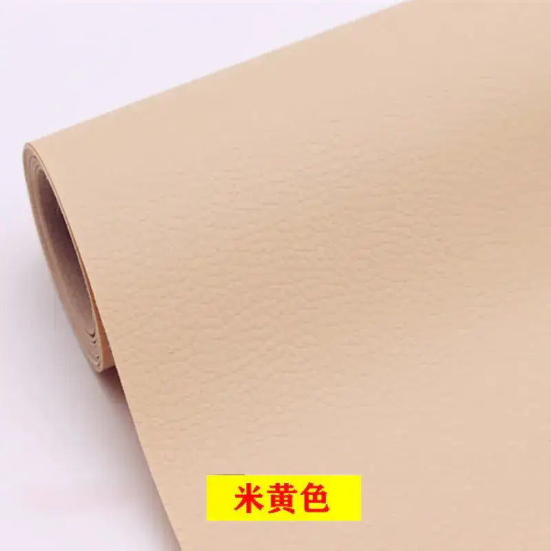 A roll of beige faux leather material with a subtle textured surface.