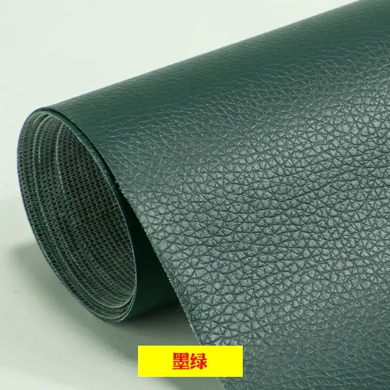 Dark green faux leather roll with a textured, pebbled surface.
