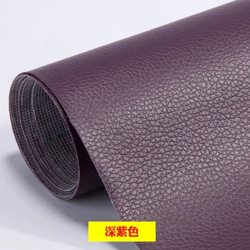 A roll of deep purple faux leather with a textured, pebbled surface.