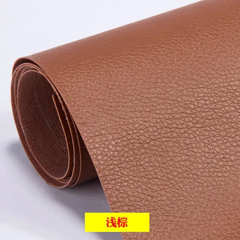 A roll of light brown faux leather with a textured, pebbled surface.