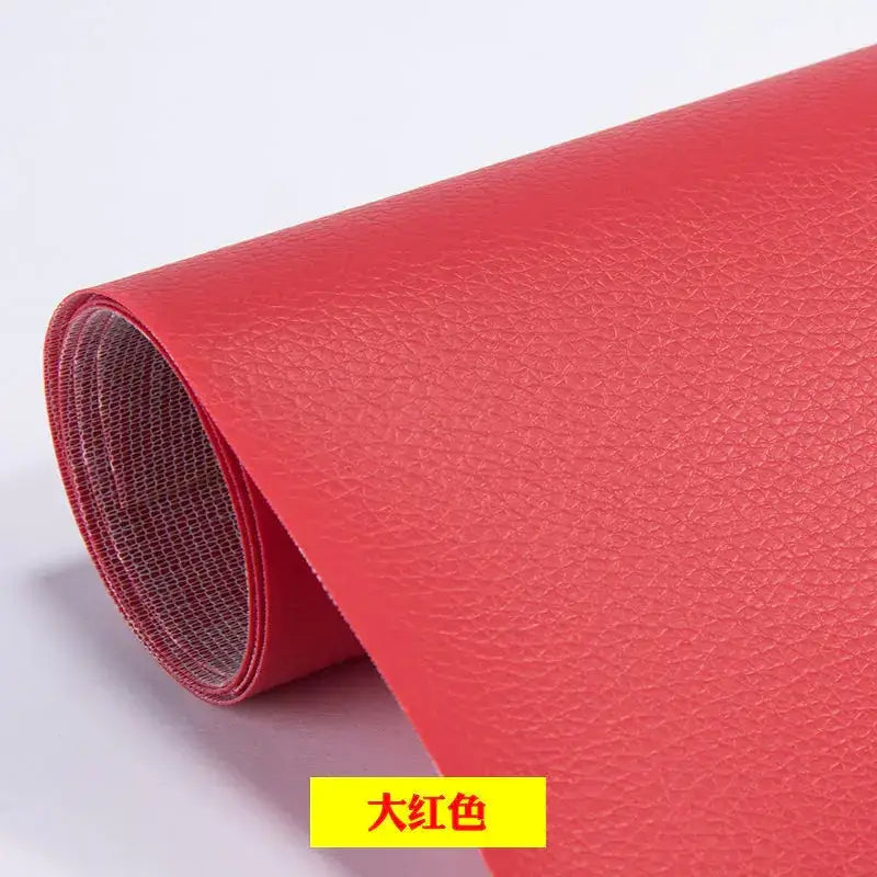 A roll of vibrant red faux leather with a textured surface.