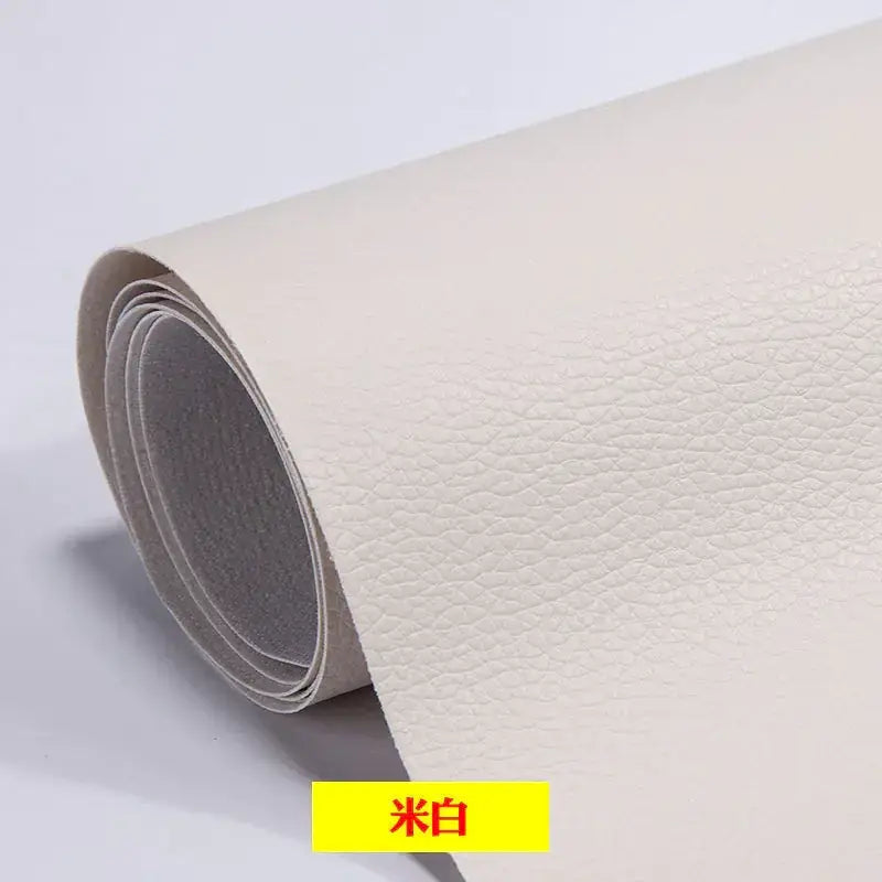 A roll of off-white faux leather with a subtle pebbled texture.